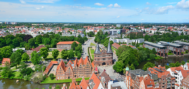 Aerial view of Lübeck old town and River Trave at sunny day, Germany. Composite photo