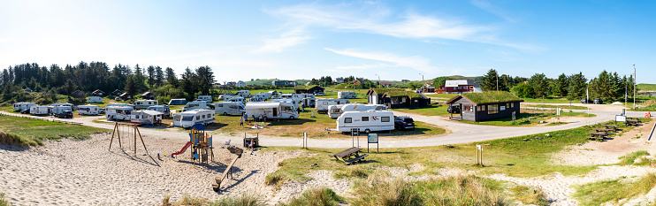 Holiday caravan park and children playground at Olberg beach in summer, Stavanger, Norway, May 2018