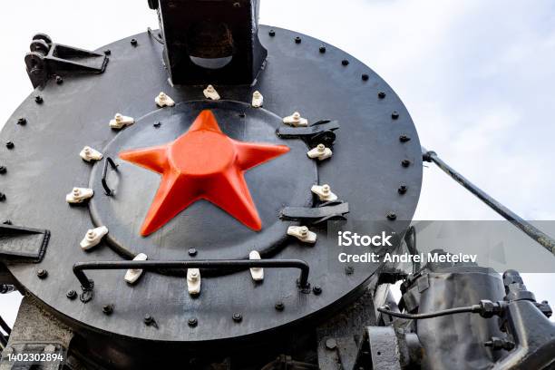 Frontal Part Of An Old Black Steam Locomotive With A Red Star Stock Photo - Download Image Now