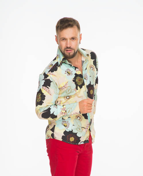 istock smiling guy in bright clothes. young man in red trousers posing on a white background isolated 1402302980