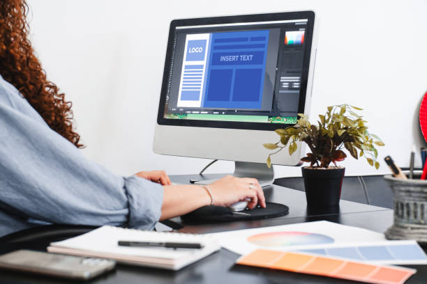 istock Hands of a person making a communication graphic template on a computer. 1402304088