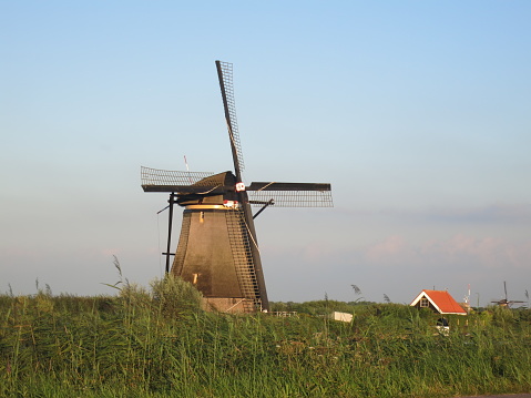 Traditional Dutch windmill canal sunset Netherlands Holland