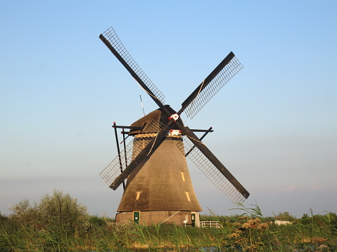 Traditional Dutch windmill canal sunset Netherlands Holland
