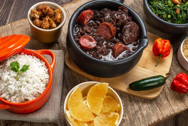 FEIJOADA: typical and traditional Brazilian cuisine, paired with Caipirinha and beer