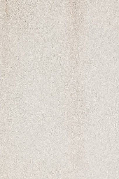 istock Part of a textured cream wall 1402306873