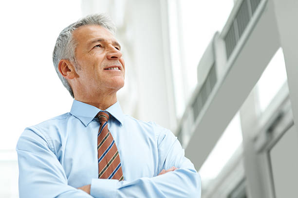 istock Successful middle age business man looking away thinking 140230712