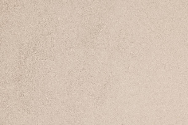 istock Part of a textured beige wall 1402307493