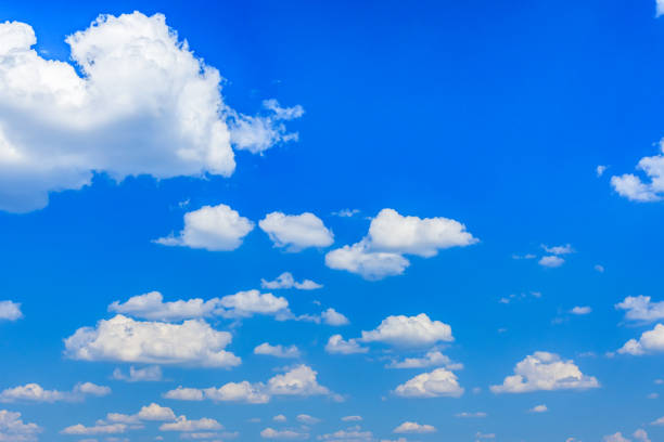 istock White fluffy clouds in the blue sky 1402309283