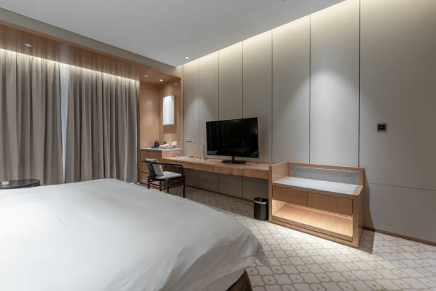 istock Simple and bright modern hotel bedroom 1402313089