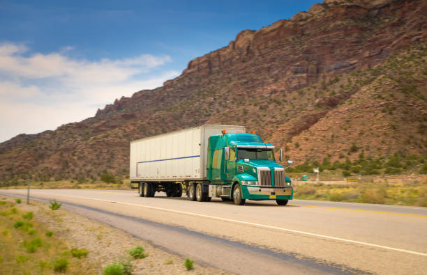 istock Refrigerated green and white  semi trailer transporting commercial cargo - panning motion blur, UTAH 1402314034