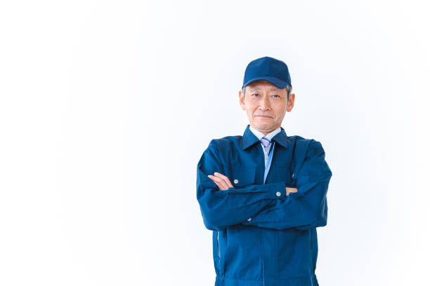 istock Delivery man smiling with his arms folded 1402314385