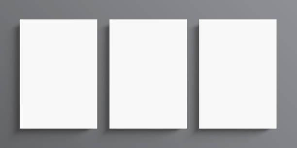 istock 3 blank white paper posters hanging on grey wall background. Poster gallery vector mockup. 1402318615