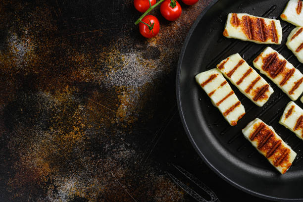 istock Grilled Halloumi, fried cheese, on old dark rustic table background, top view flat lay, with copy space for text 1402319847