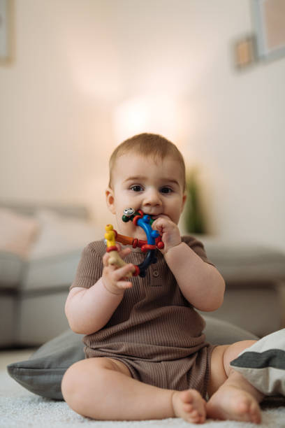 istock RTeething baby boy biting toys 1402321111