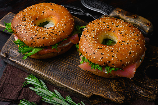 Fresh Smoked Salmon And Cream Cheese Bagel set, on old dark  wooden table background