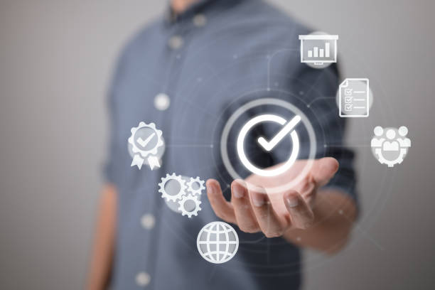 istock Quality management with quality assurance, QA, and quality control, QC, and improvement. Standardized and certification concepts. Compliance with regulations and standards concept with the manager. 1402322019