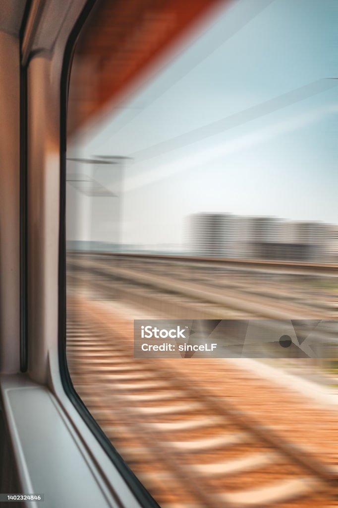 blurred abstract green landscape seen from a window train in motion Looking Through Window Stock Photo