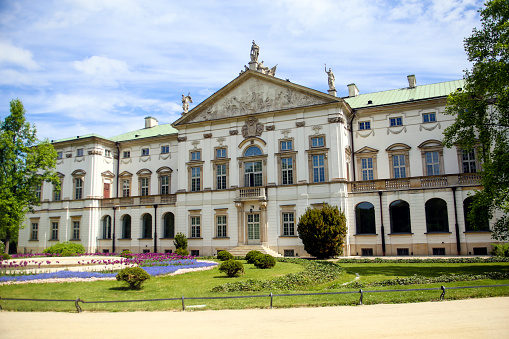 Krasinski Palace is a baroque palace with an ornate facade and formal gardens in Warsaw, Poland.