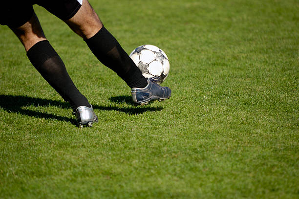 istock Kick the ball with black socks 140232640