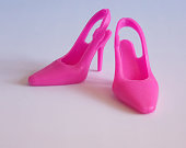 Toy doll pink high-heeled shoes.