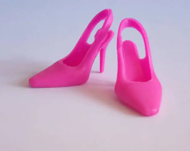 Toy doll pink high-heeled shoes.