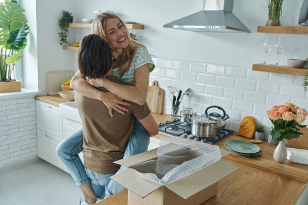 istock Young couple embracing and smiling 1402328319