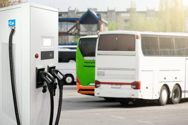 istock Electric buses with charging station 1402328560