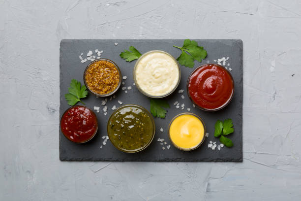 istock Many different sauces and herbs on table, flat lay top view. sauces on plate, healthy concept 1402330738
