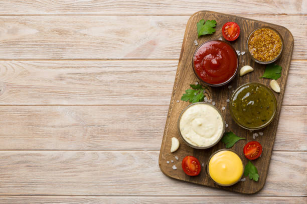 istock Many different sauces and herbs on table, flat lay top view. sauces on plate, healthy concept 1402330752