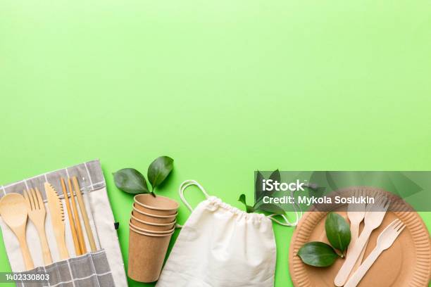 Set Of Empty Reusable Disposable Ecofriendly Plates Cups Utensils On Light White Colored Table Background Top View Biodegradable Craft Dishes Recycling Concept Closeup Stock Photo - Download Image Now