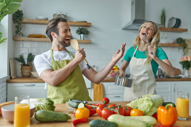 istock Beautiful young couple singing and having fun 1402330907