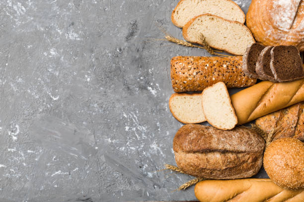 istock Homemade natural breads. Different kinds of fresh bread as background, top view with copy space 1402331072