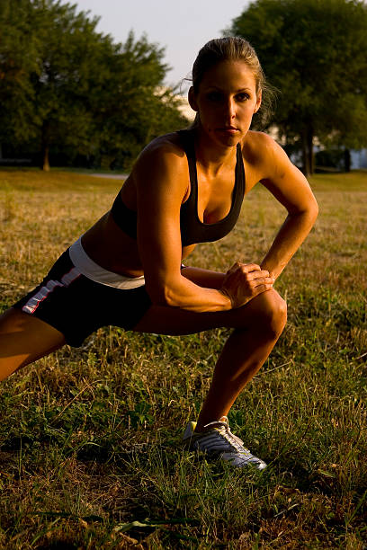 Female doing side lunge to the right. stock photo