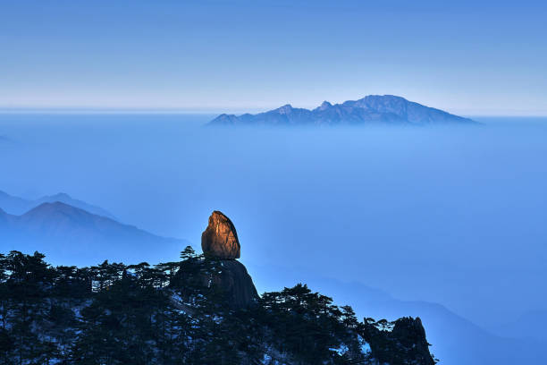 Huangshan Mountain on Cloud-Sea at Sunrise Huangshan mountain (Feilai stone) on cloud-sea at sunrise, China. huangshan mountains stock pictures, royalty-free photos & images