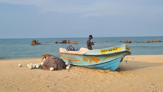 Kuchchaveli, Sri Lanka – April 19, 2022: Fishermen boats on the beach in Kuchchaveli, Sri Lanka.