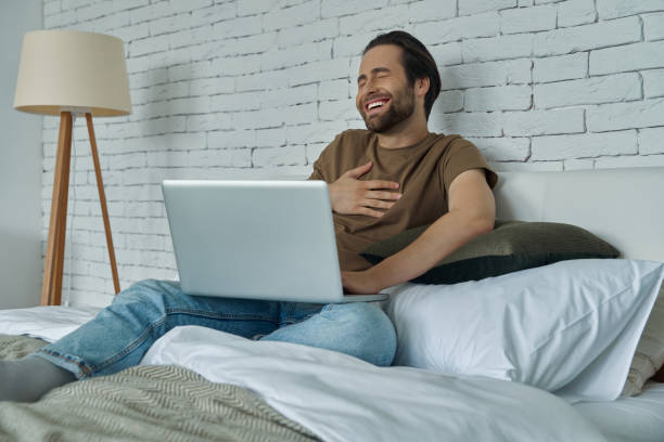 istock Handsome young man laughing out loud 1402332200