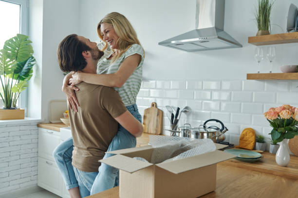 istock Young couple embracing and smiling 1402333015