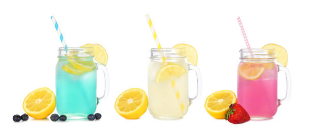 istock Colorful summer lemonade drinks in mason jar glasses with fruit ingredients isolated on white 1402333020