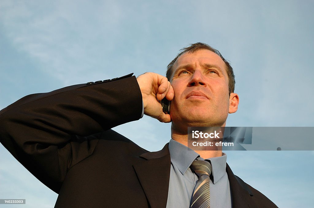 Phone talking Businessman having phone talking in the evening Adult Stock Photo