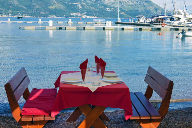 istock Served table on sea beach restaurant of Budva, Montenegro. 1402333285