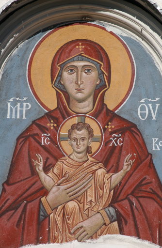 The Virgin and Child, an ancient fresco above the gate of an orthodox church in Pskov, Russia.