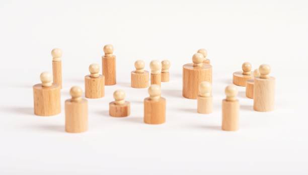 istock Montessori knobbed cylinders placed in random order. Puzzle pieces of various diameter and height. Disorder, confusion concept. 1402336508
