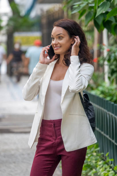 istock Young woman talking on cellphone 1402336986