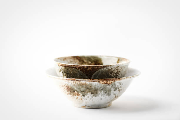 istock Traditional ceramic bowls on bright paper background. Soft focus. Close up. Copy space. 1402337753