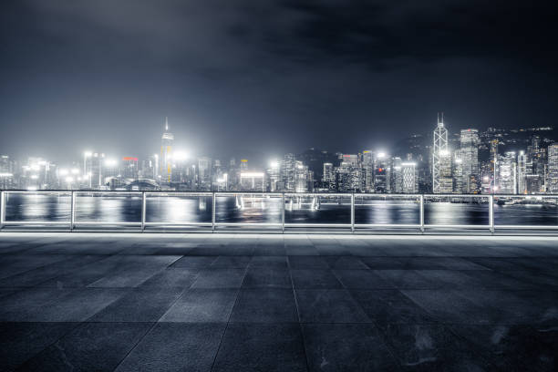 istock Empty brick platform with Hong Kong skyline in background at night 1402337915