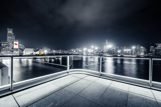 istock Empty brick platform with Hong Kong skyline in background at night 1402337918