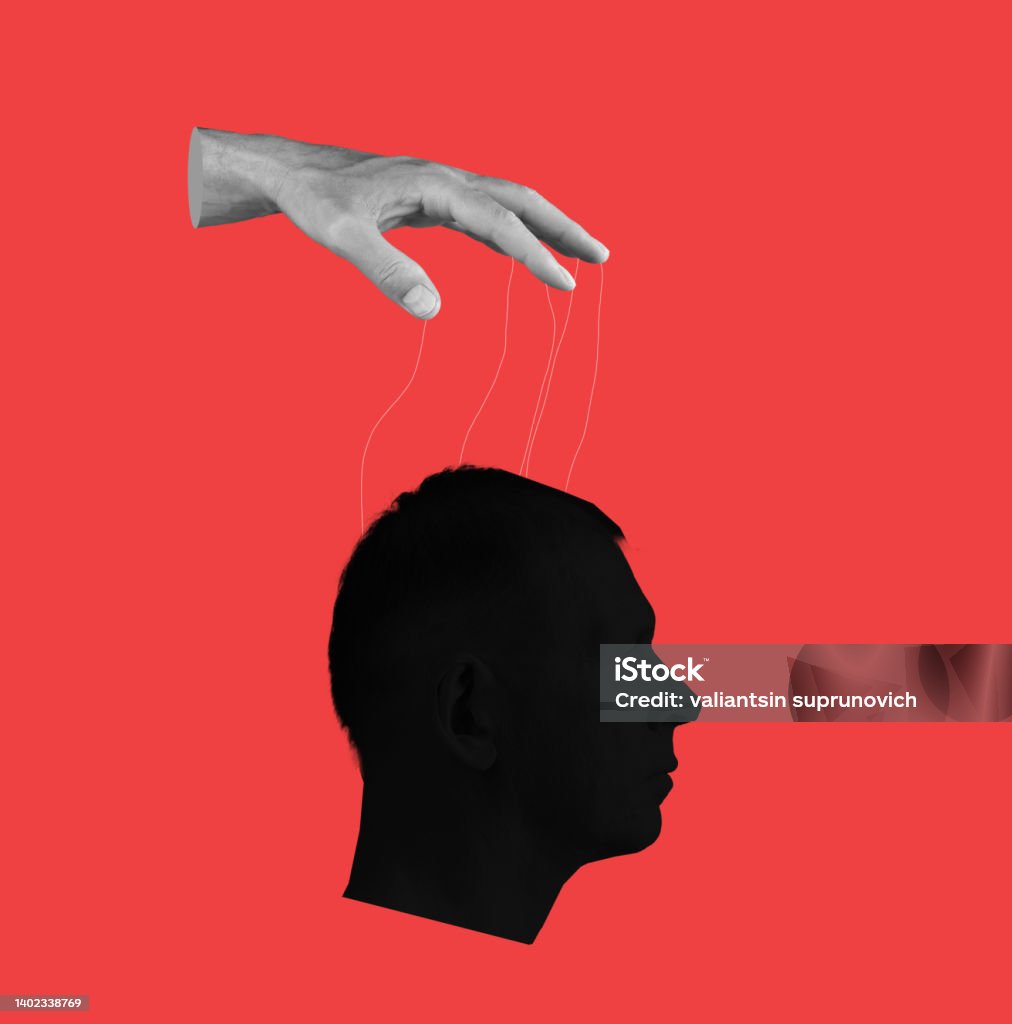 Control over human mind. Hand with strings and head on red background. Manipulation of person consciousness, thoughts, opinion. Control over human mind. Hand with strings and head on red background. Manipulation of person consciousness, thoughts, opinion. High quality photo Conspiracy Stock Photo