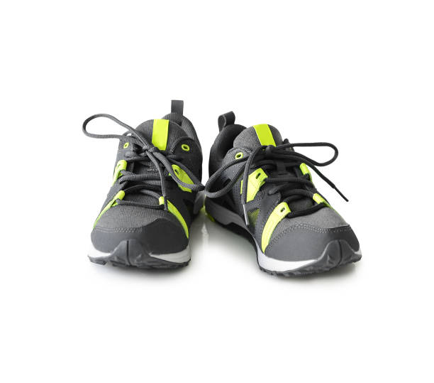 istock grey sneakers with neon green inserts 1402339460
