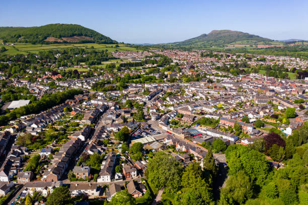 aerial view of the welsh town of abergavenny surrounded by green fields and hills - monmouth wales imagens e fotografias de stock