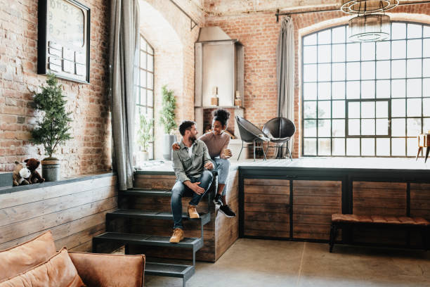 istock Romantic multi ethnic couple enjoying weekend at home, in modern Manhattan style loft 1402342619